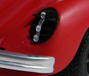 Ninja Cheerleaders Volkswagen Beetle damaged tail light detail